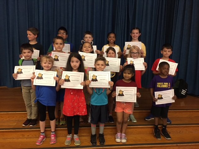 group of student show off their award certificates