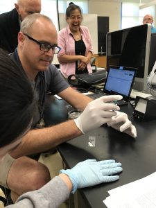 teacher works on a science experiment