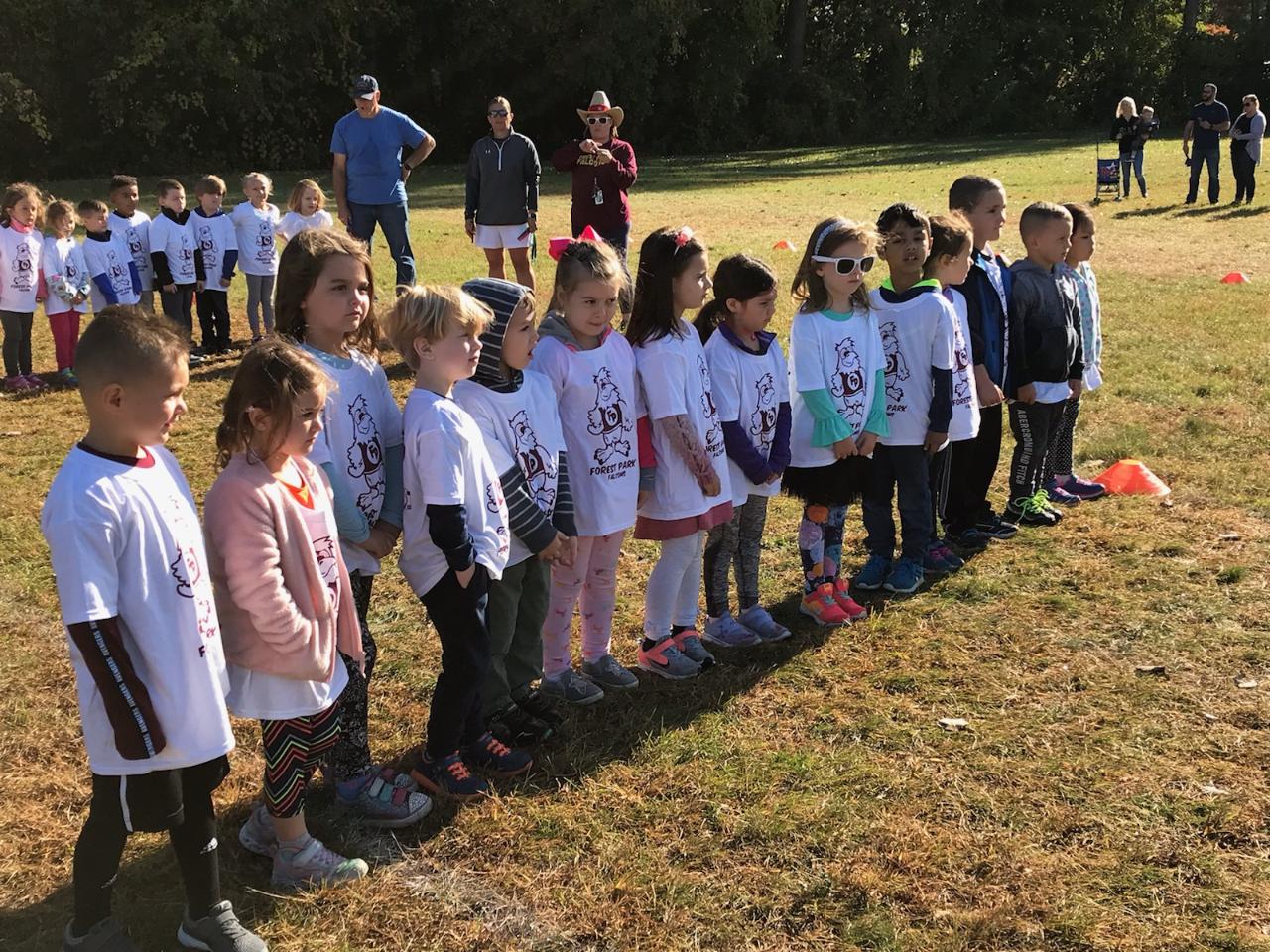 students line up in their T shirt for start of fun run