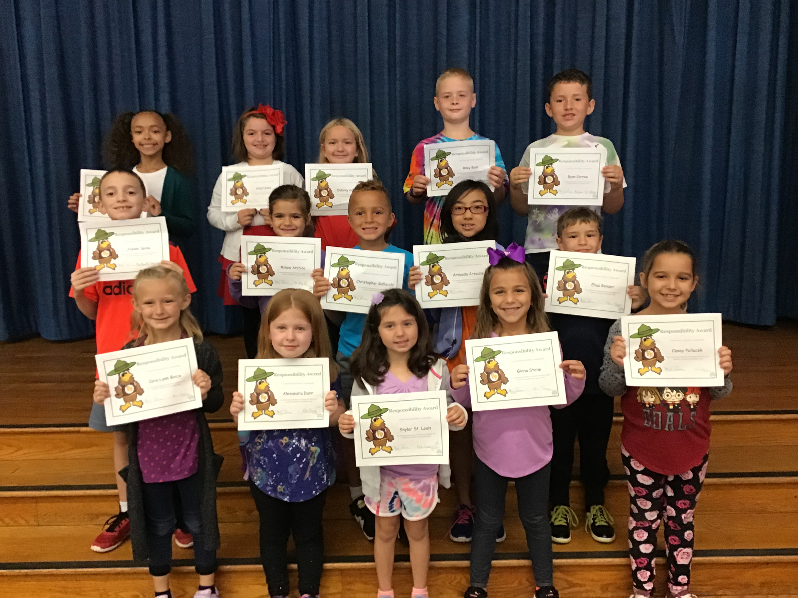 group of students with their award certificates