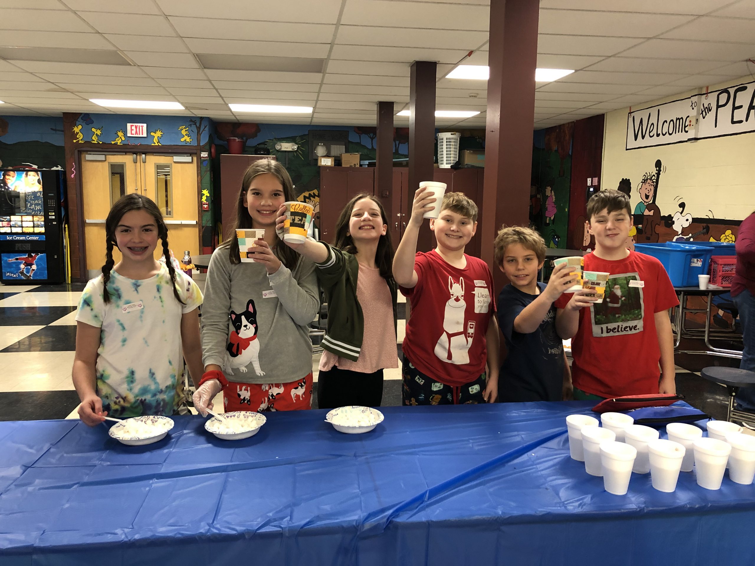 group of student drink hot chocolate at a table