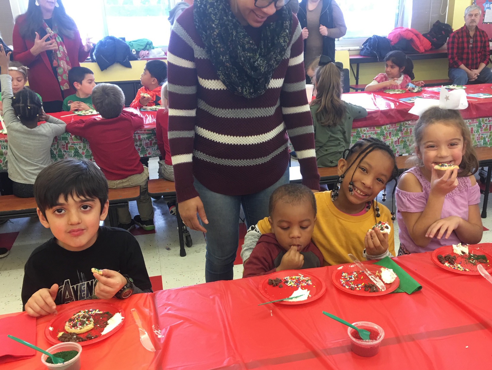 children enjoy eating cookies together