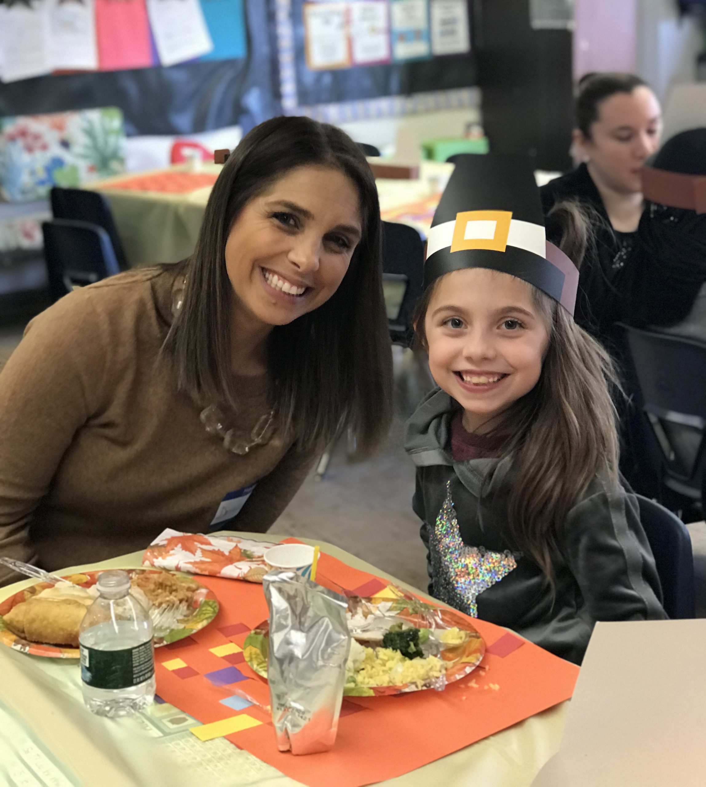 mother and daughter at thanksgiving feast