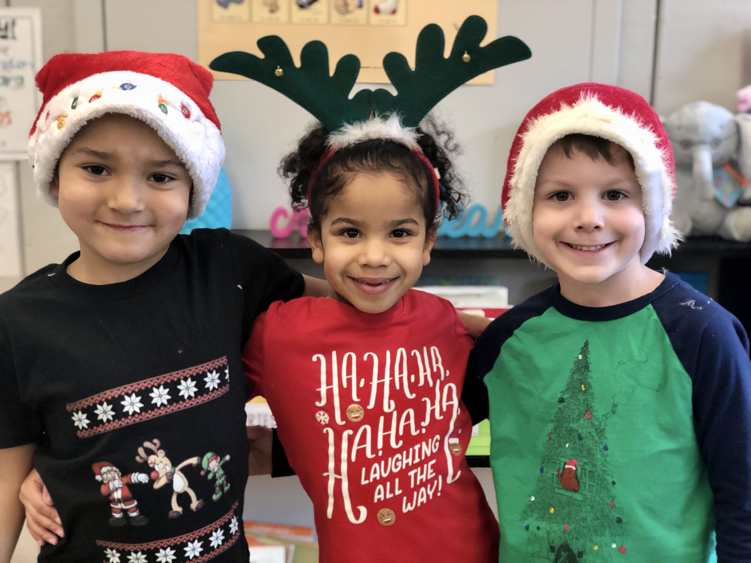 three children dressed in christmas clothes