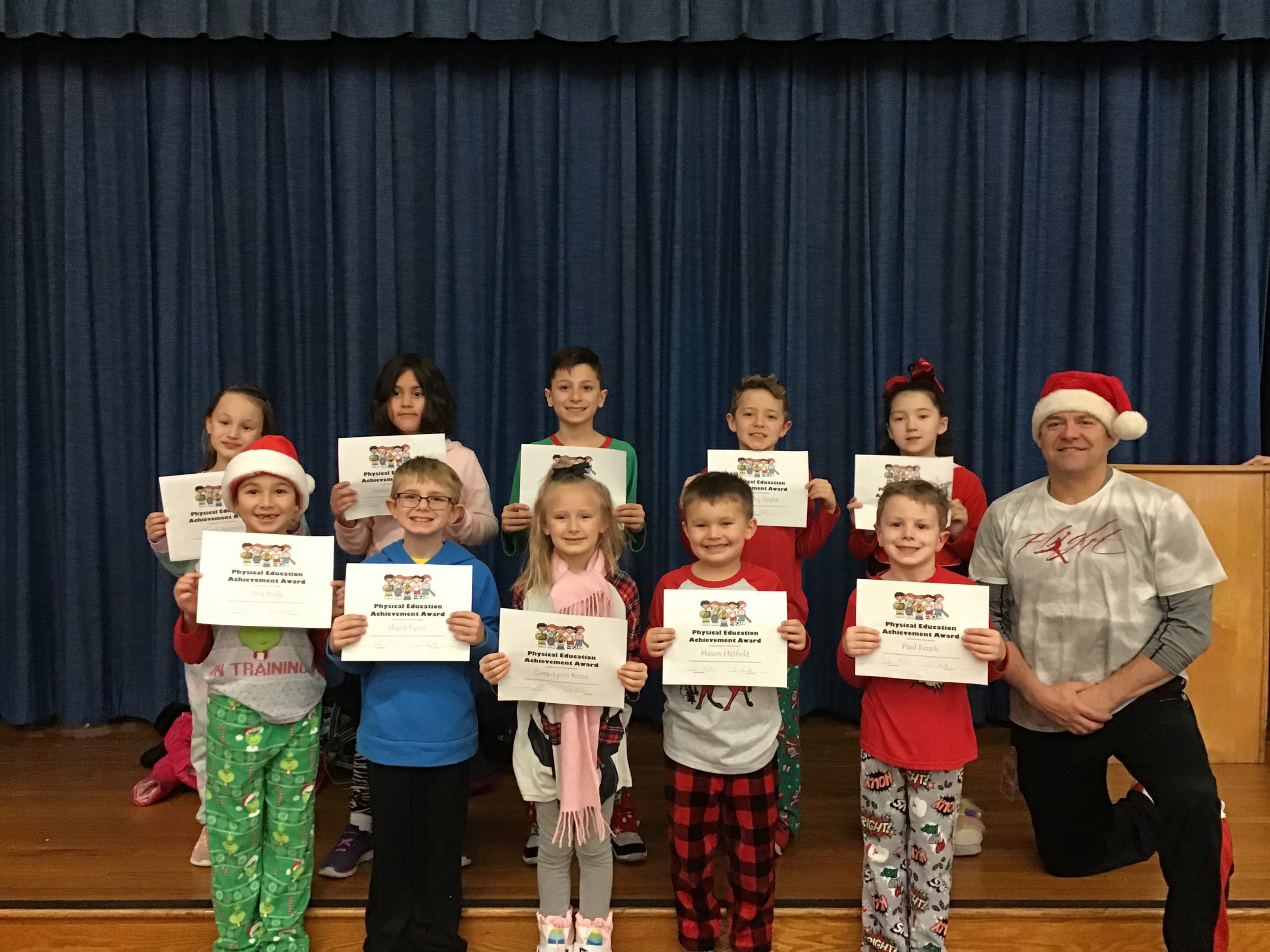 group of students show off their award certificates