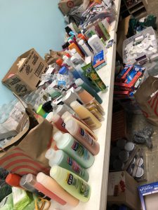 a collection of hygiene products lined up on a table