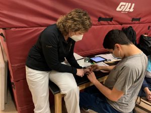 PAES Lab co-facilitator Ms. Hoerup instructing a student.