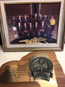 Team photo and championship plaque of the 2001 South Colonie Girls’ Varsity Basketball championship winning season.