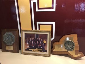 Team photo and championship plaque of the 2001 South Colonie Girls’ Varsity Basketball championship winning season.