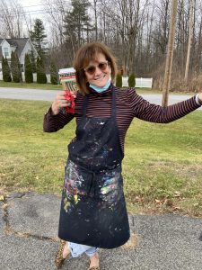 Veeder Elementary Art Teacher Mrs. Ryan posing for a picture outside of class.