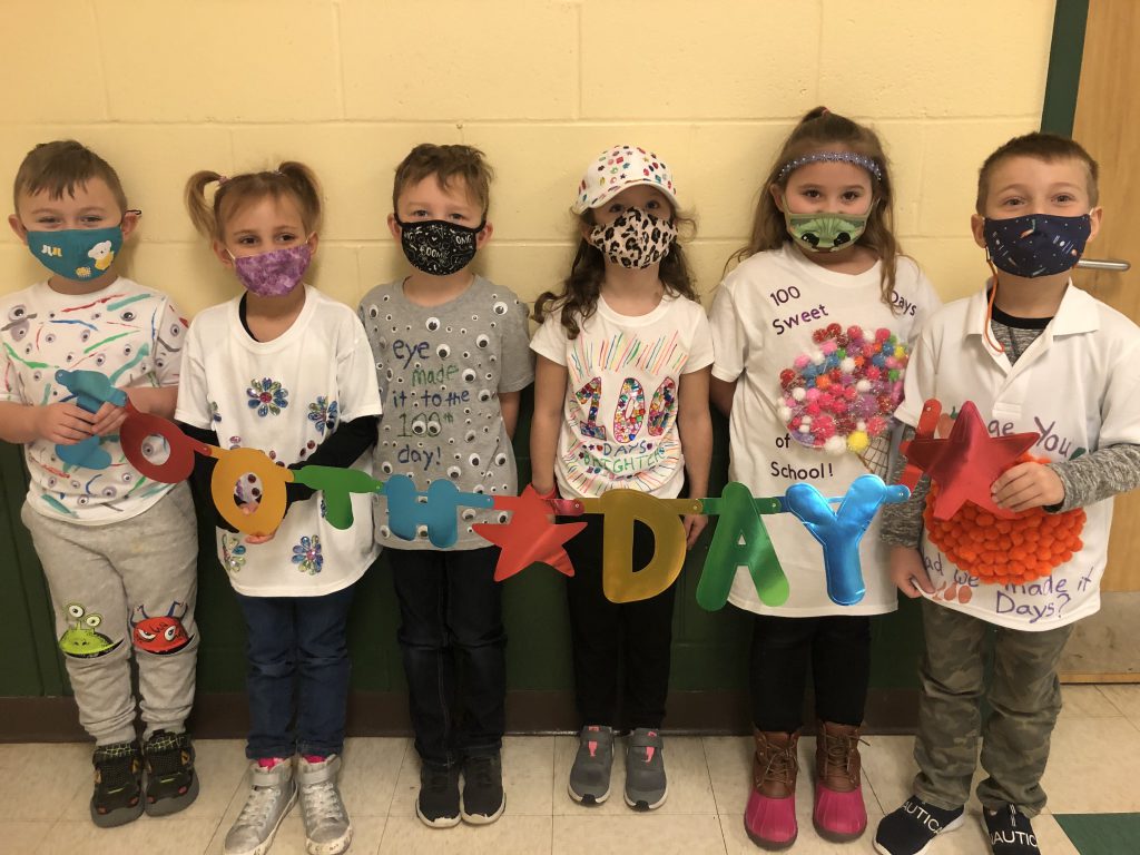 students showing off their homemade t-shirts