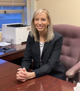 headshot of a female in an office setting