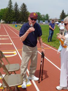 Harry Koch speaks takes the mic during the Colonie Relays on Saturday, May 22 at Colonie Central High School.