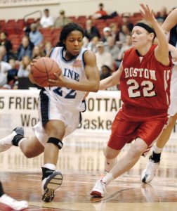 two people play college basketball