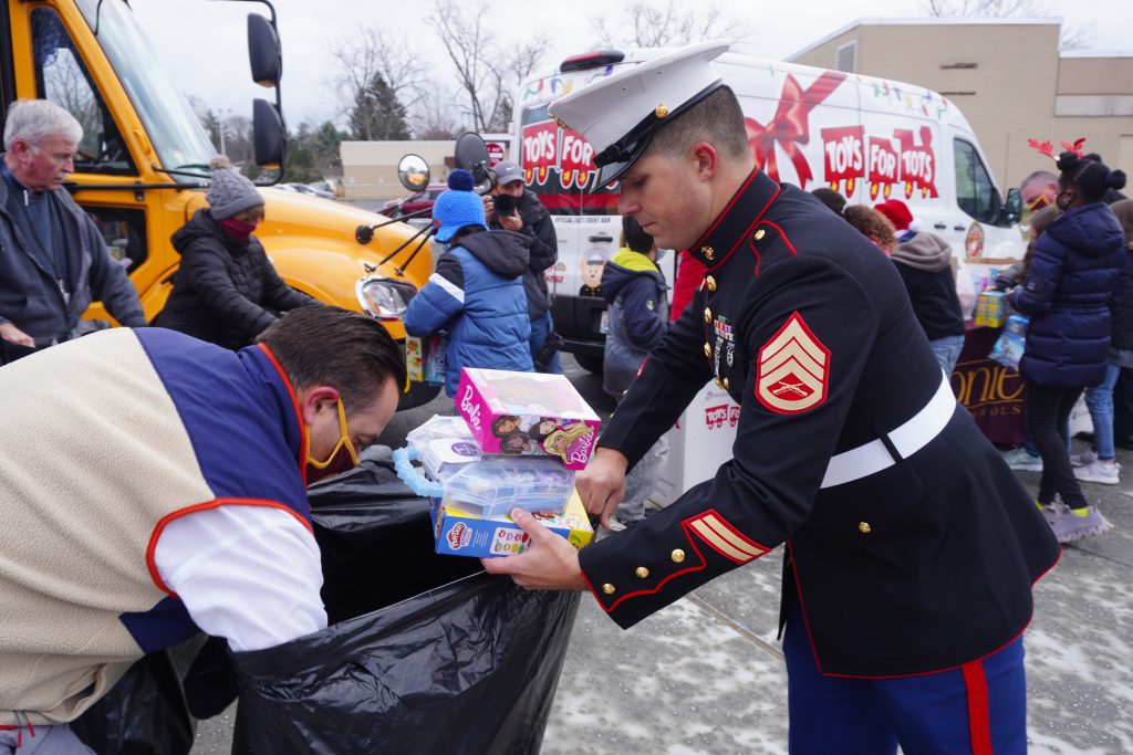 Marine helps to move toys