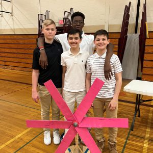 students pose with their own hand made turbine