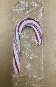 photo of a candy cane in a wrapper