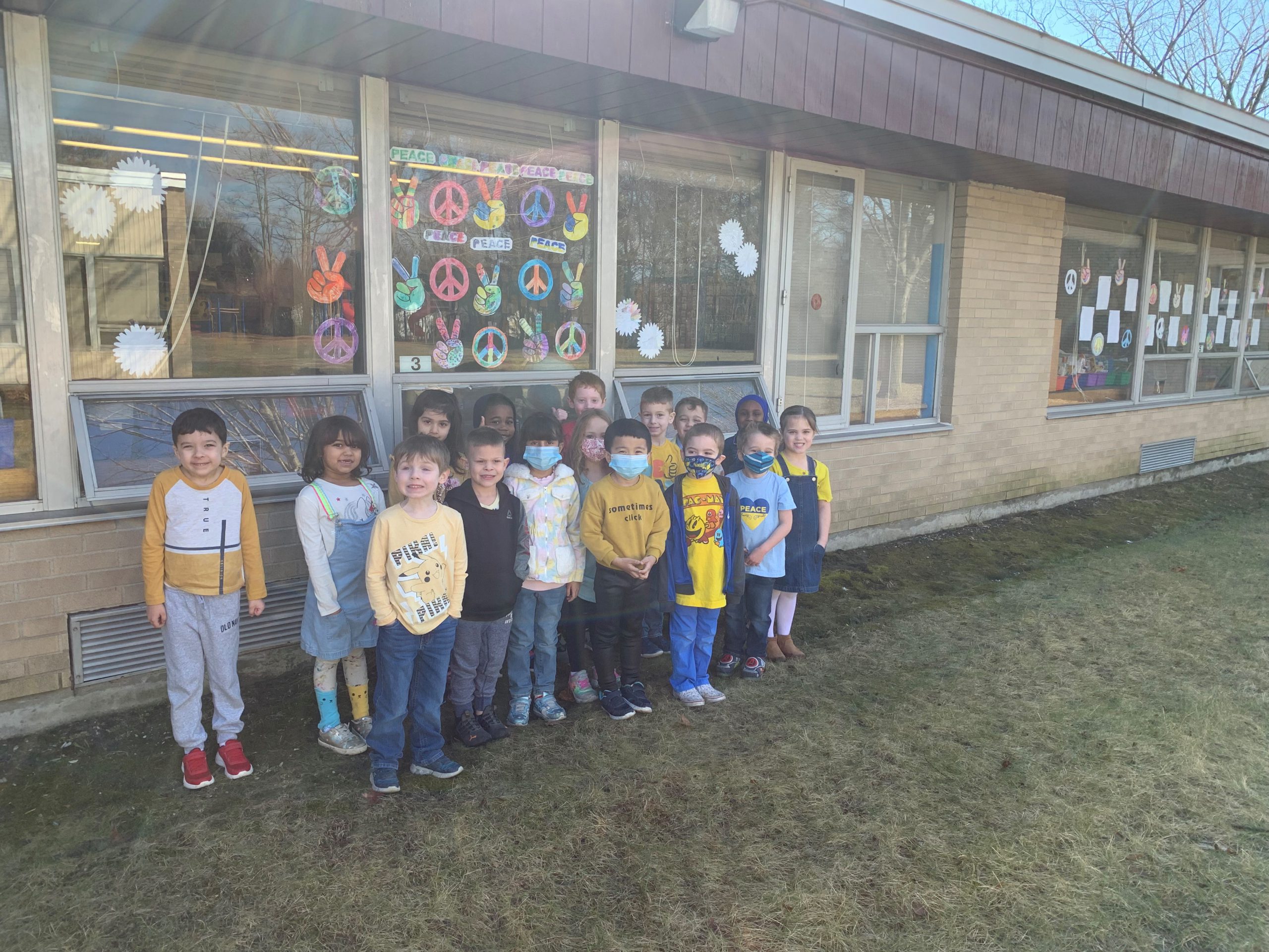 Saddlewood students stand outside the building