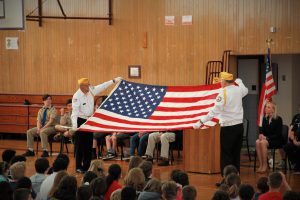 Flag folding ceremony conducted by the district's special guests Commander Art Dutcher, Mr. Dave Seymour and Sergeant Gary Squires.