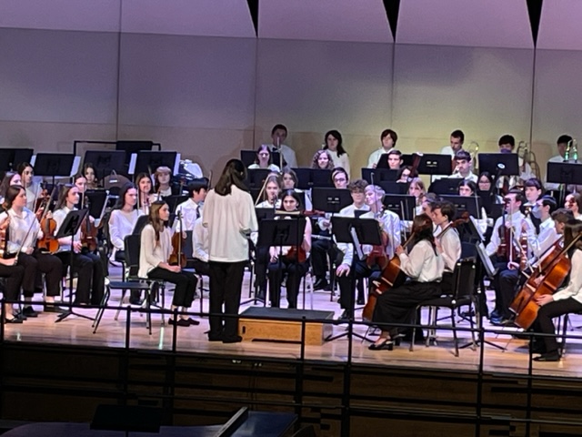 Lillian Rogers (Concertmaster) from South Colonie tuning the orchestra.