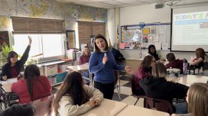 Teacher in her classroom giving a lesson