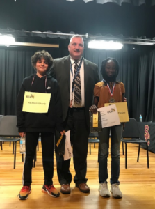 Spelling bee students and Superintendent of Schools Dr. David Perry