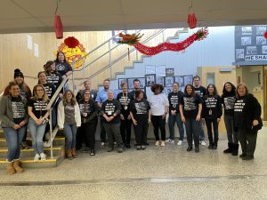 Staff in their black history month shirts.