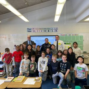 a group of students posing with the Colonie PD. 