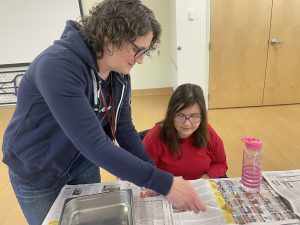 CCHS teacher Keri Martinez helps her student make dog treats