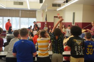 Shaker Road Elementary students cheer on the racers