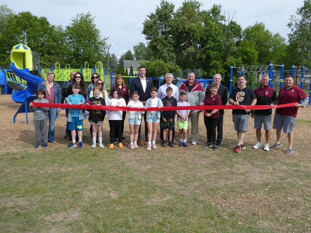 photo opp before ribbon cutting in front of a new playground. 