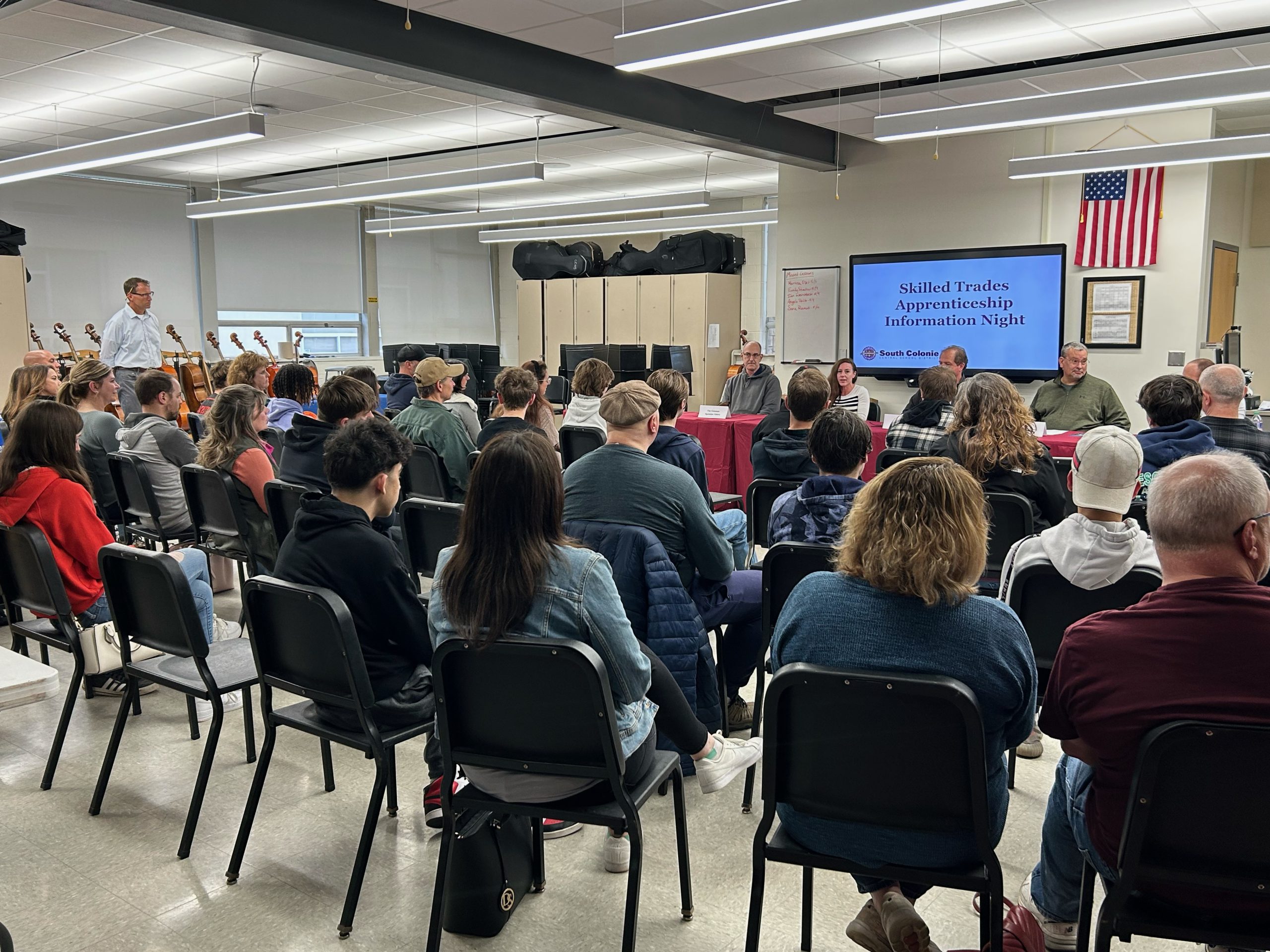 Students and families seated listening to panel members at the Skilled Trade Apprenticeship Information Night