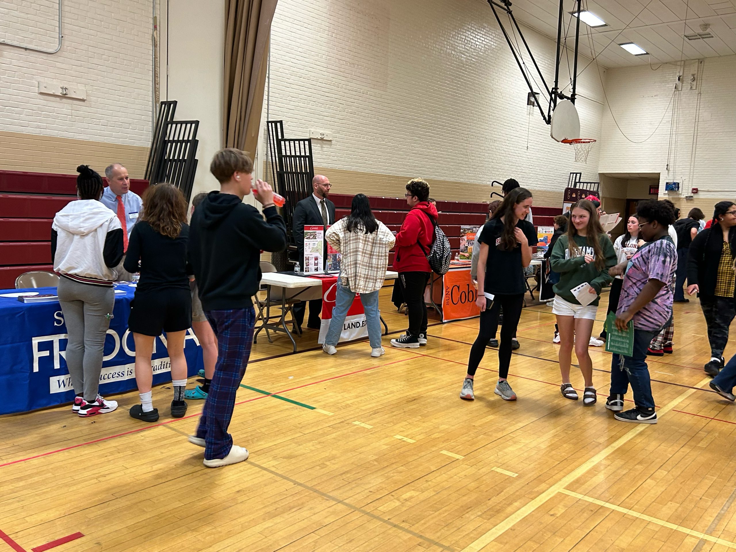 Students talk to the representatives at booths during the College and Career Fair