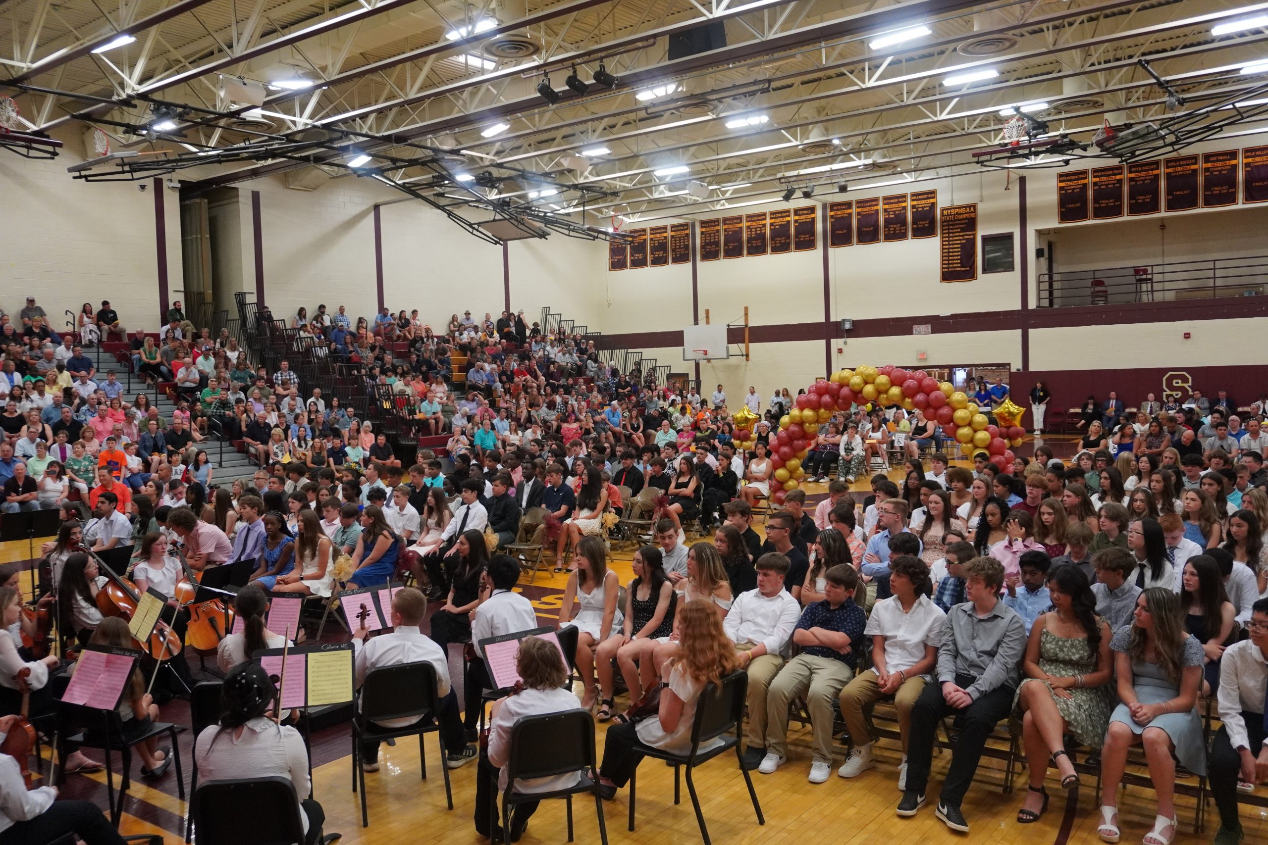 Students and families gather together in the MUG