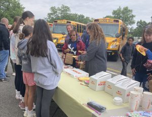 bus drivers enjoy goodies at morning drop off at Sand Creek Middle School on Friday, June 9.