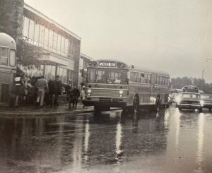 Colonie Central High School with a bus in front.  Old photo representing 1950s-1960s.