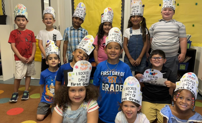 kids posing for a photo wearing crowns that says we rocked