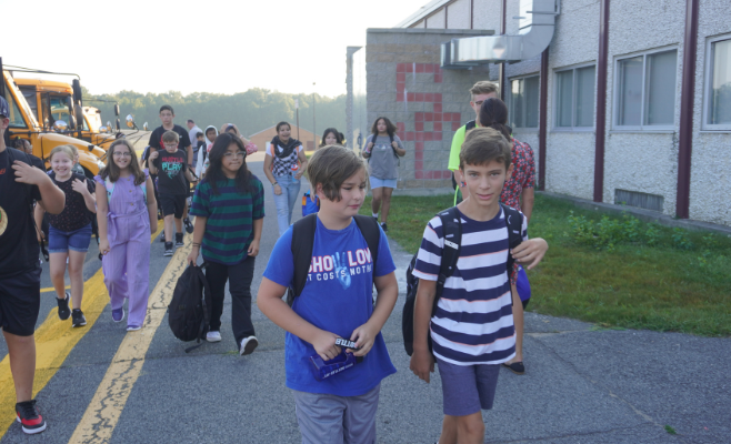 Students arrive at Sand Creek for the first day of school.