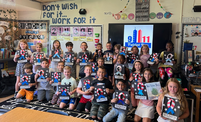 students show off their ribbon projects in honor of Patriot Day