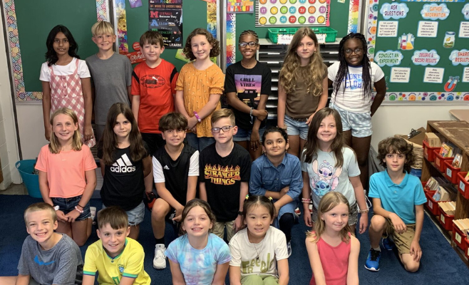 fourth grade class poses for a first day of school picture