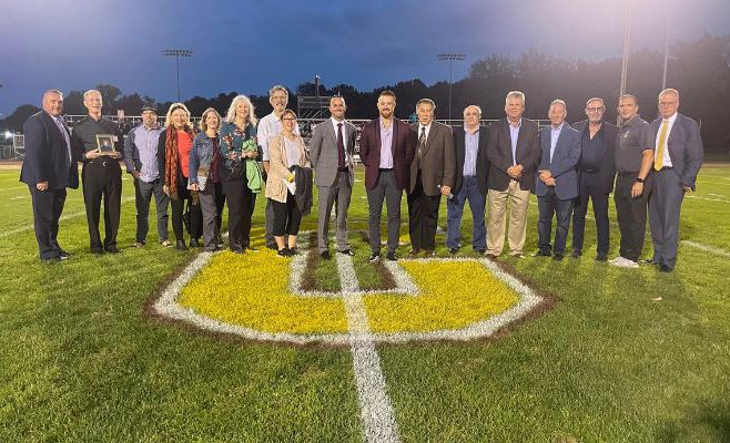 Hall of Fame Inductees on the field.