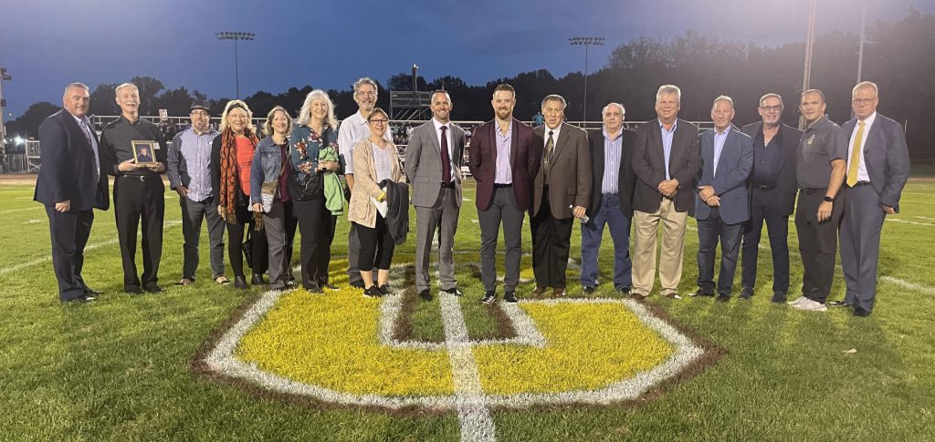 Hall of Fame Inductees on the field.