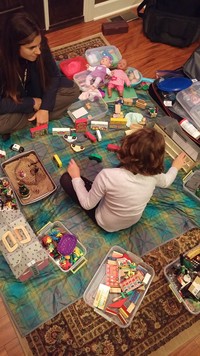 Erin Hassall, LMFT, RPT demostrating Child-Center Play Therapy with her daughter using the Mobile Play Therapy Kit