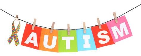 Austim symbol in rainbow color hanging on a closeline Austim symbol in rainbow color hanging on a closeline