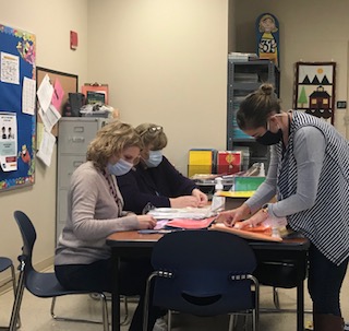 Stafford Public Schools staff members working together creating "At Home" kits. Stafford Public Schools staff members working together creating "At Home" kits.
