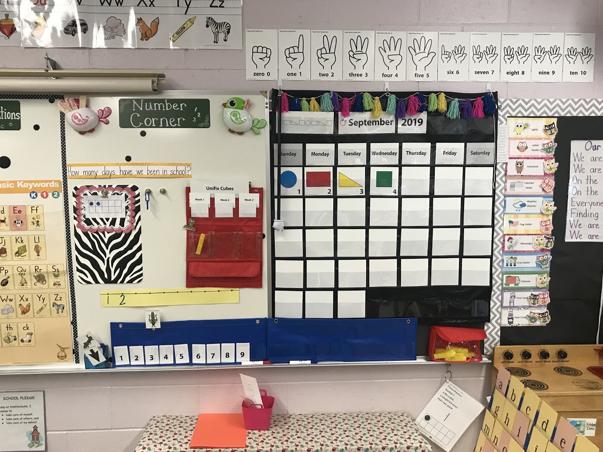 Classroom settings with a calendar on the right and a 'number corner' on the left. Classroom settings with a calendar on the right and a 'number corner' on the left.
