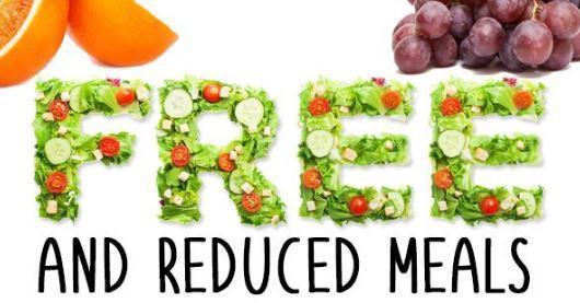 The word FREE is spelled out using salad. Underneath reads 'and reduced meals'. Above the word free on the left is oranges and on the right, apples, both cut off by the image's border.