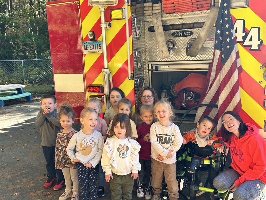 WSS students posing in front of a firetruck