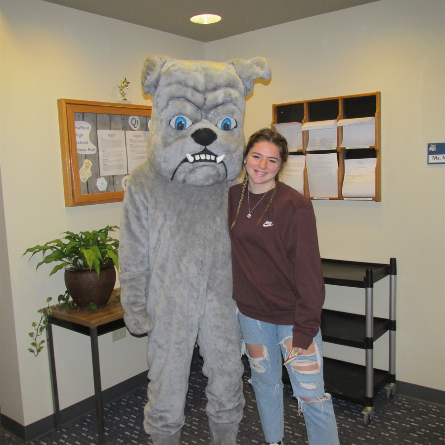 Portrait of the Bulldog of the Month and the high school mascot.
