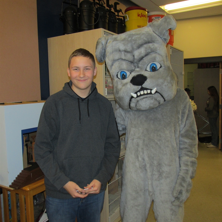 Portrait of the Bulldog of the Month and the high school mascot.